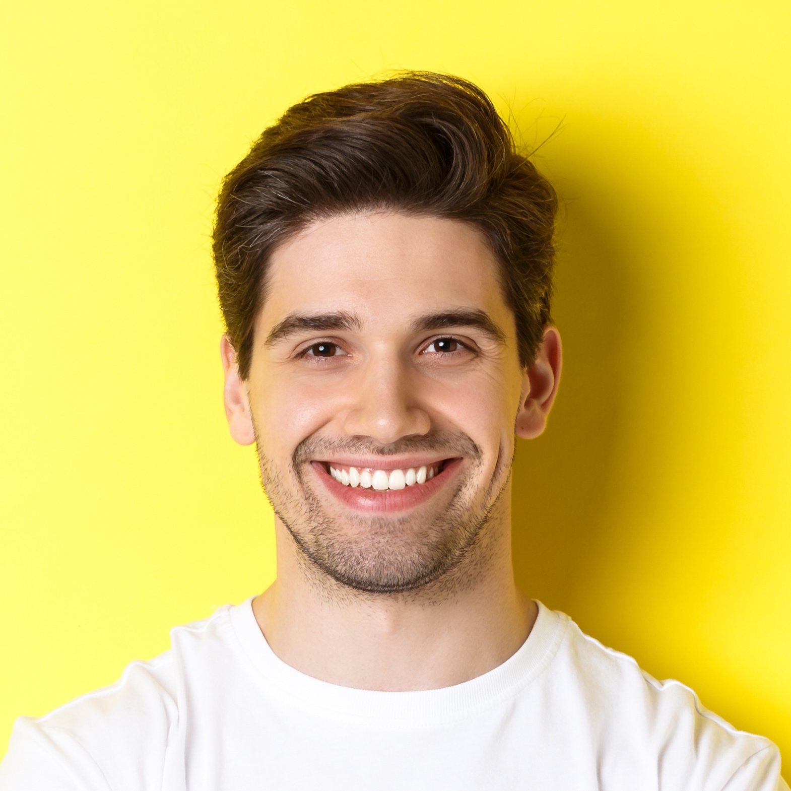image-confident-caucasian-man-smiling-pleased-holding-hands-crossed-chest-looking-satisfied-standing-yellow-background-2