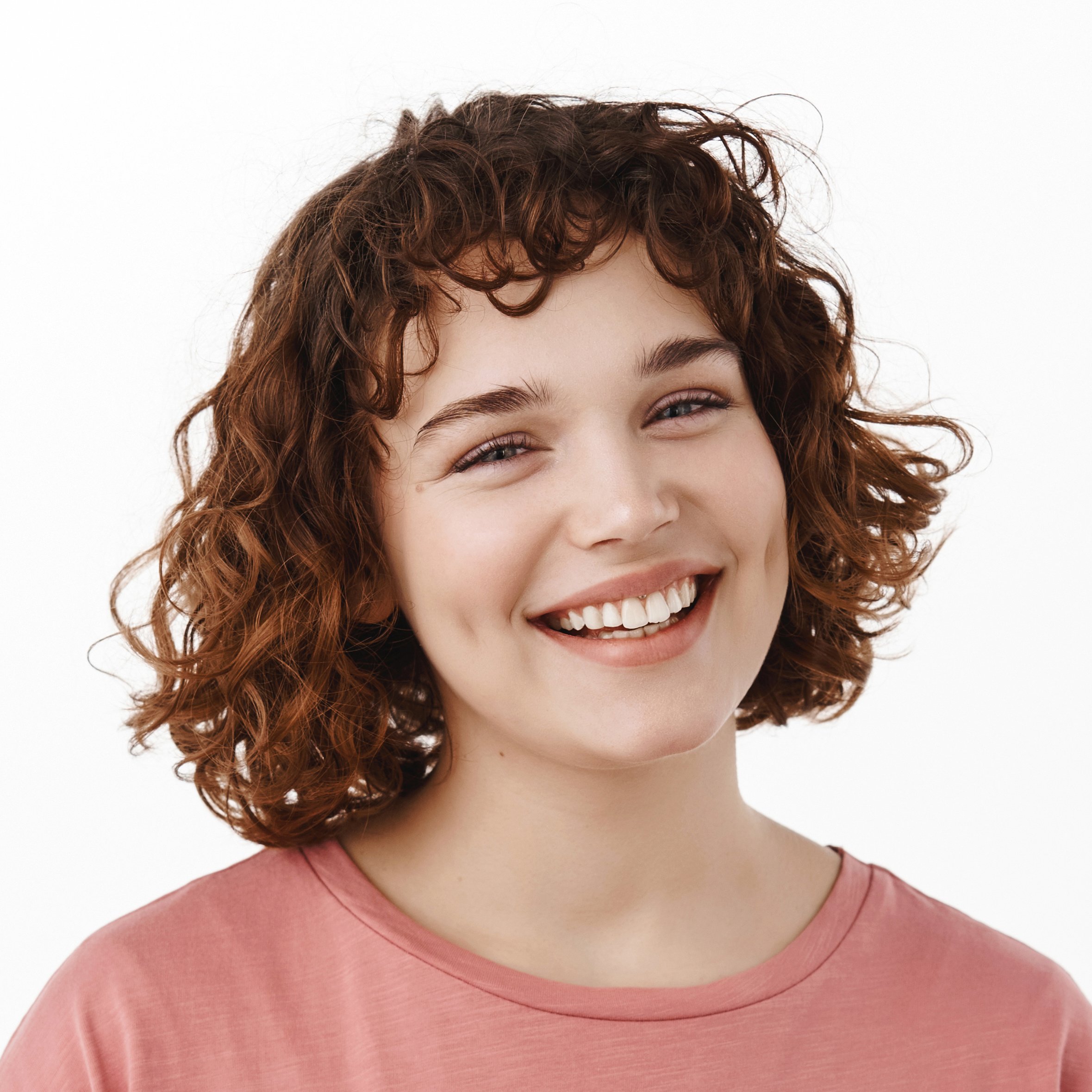 portrait-attractive-happy-girl-with-curly-short-hair-lovely-white-smile-laughing-gazing-cheerful-camera-standing-t-shirt-against-white-background